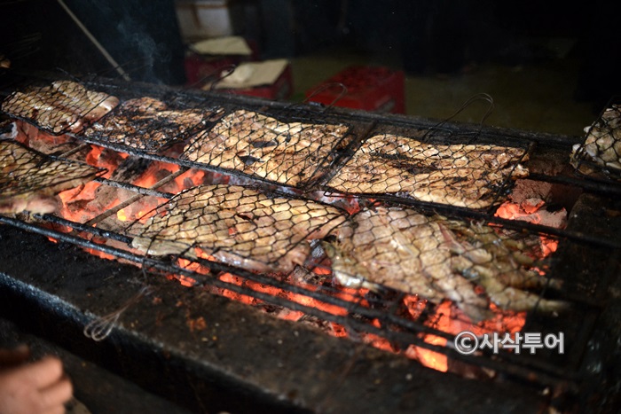 Seafood cooking over charcoal
