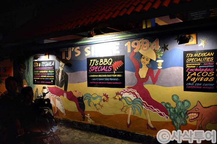 TJ’s exterior at night