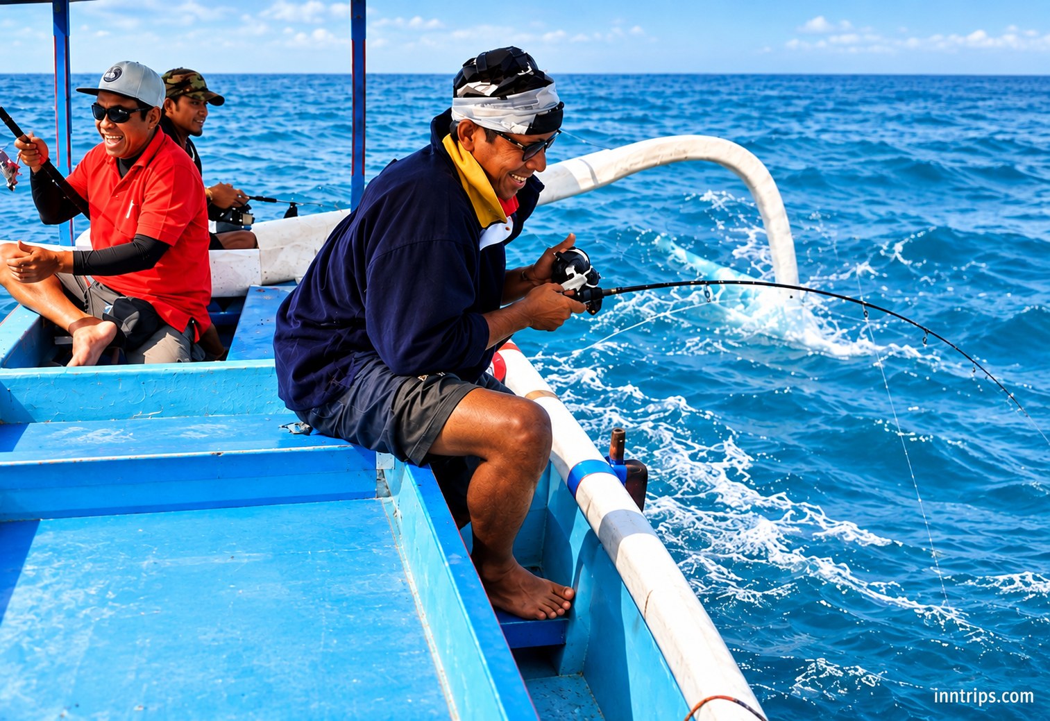 Anglers fishing from a traditional wooden boat in Bali