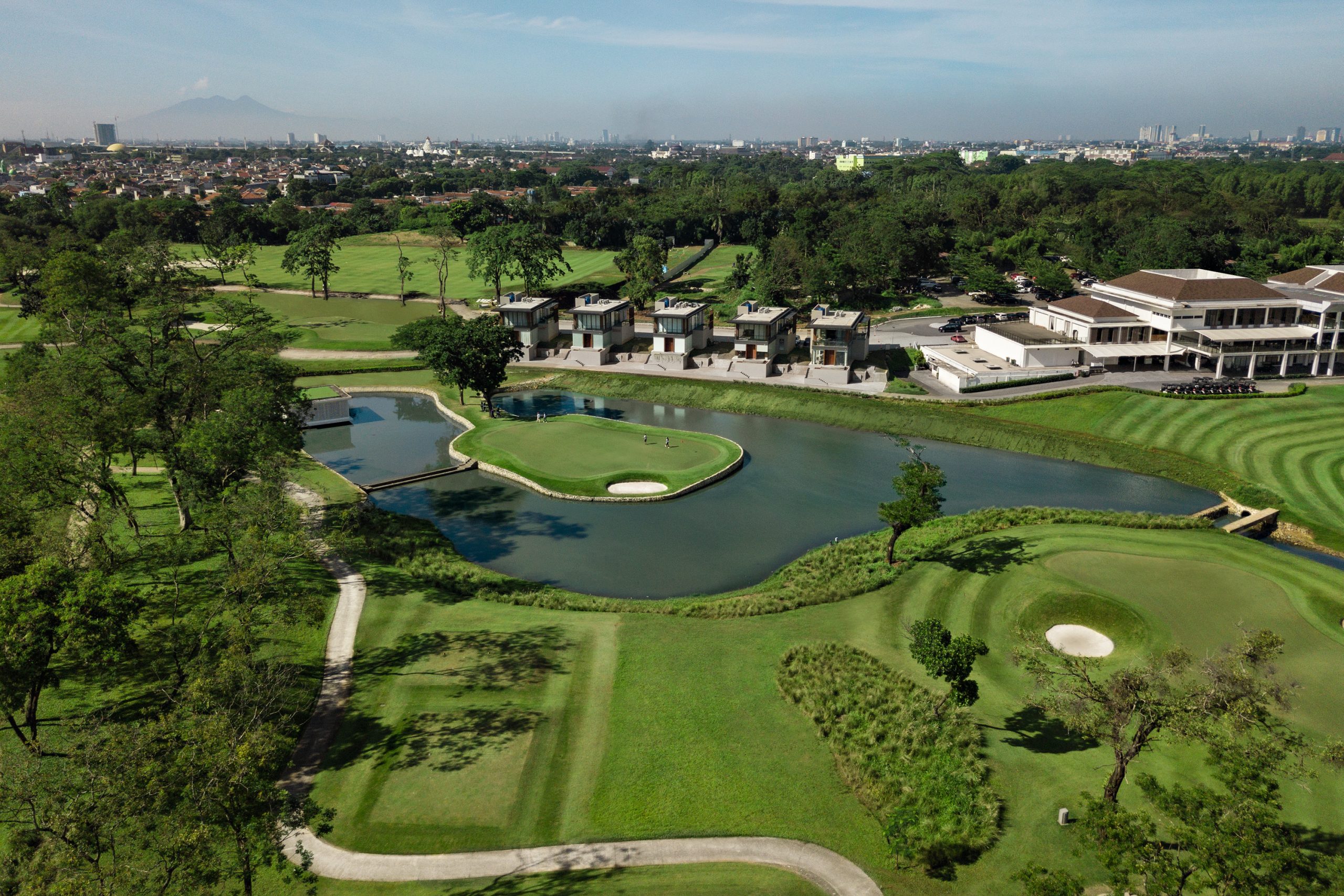 Aerial view of a golf course and green fairways