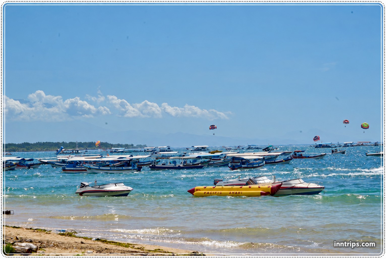 Boats and activity equipment along the beach