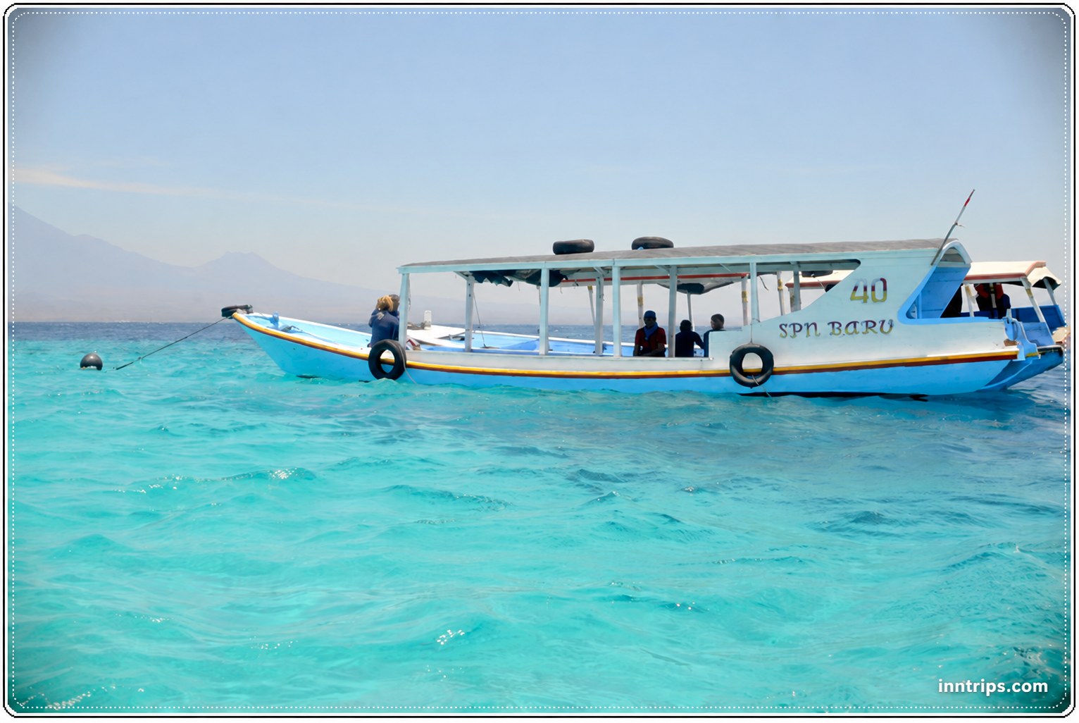 Local boat on the clear water near Menjangan