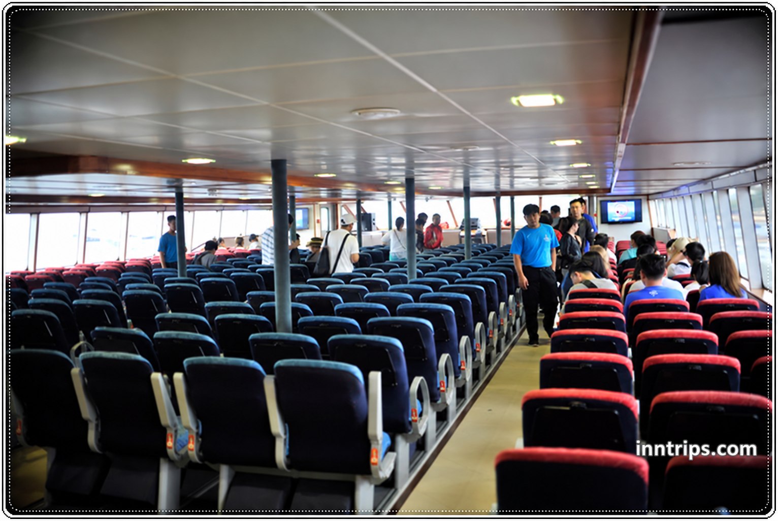 Passengers seated inside the Quicksilver cruise cabin