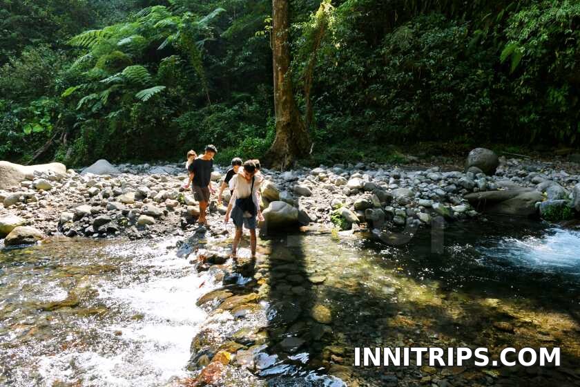 Forest path and river crossings · North Lombok waterfall tour photo 36
